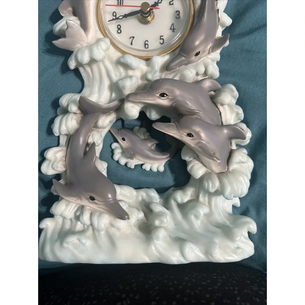 Source Unknown dolphin clock